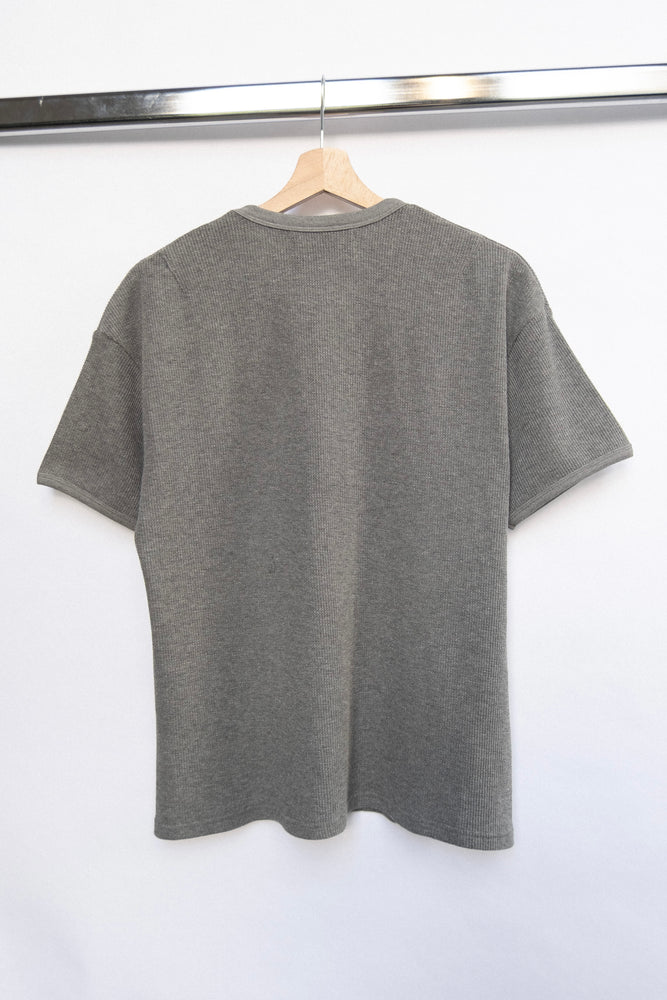 
                  
                    WAFFLE KNIT T-SHIRT GREY
                  
                
