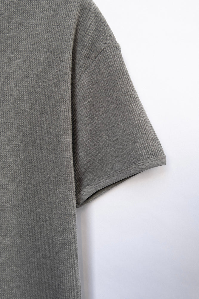 
                  
                    WAFFLE KNIT T-SHIRT GREY
                  
                