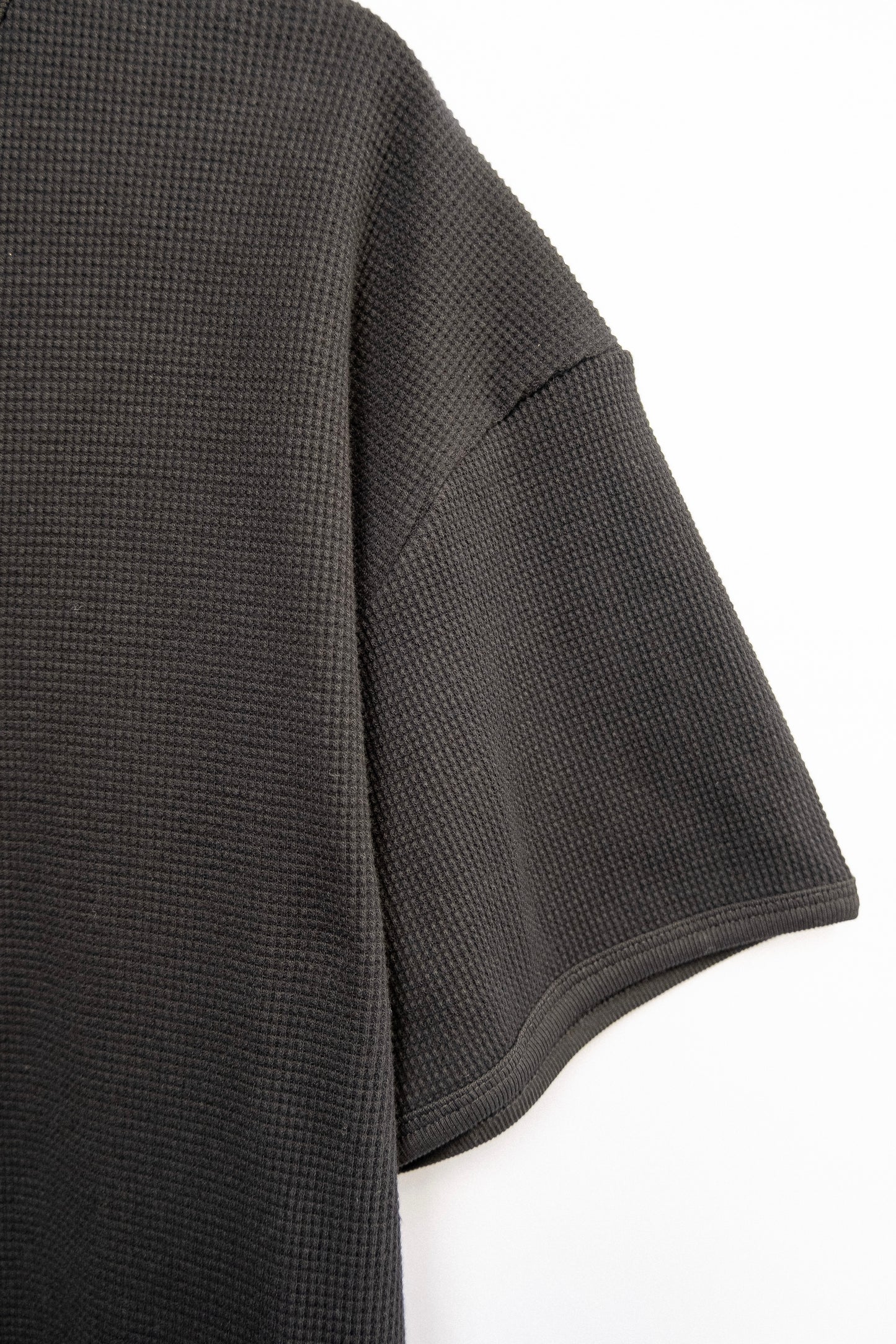 
                  
                    WAFFLE KNIT T-SHIRT BLACK
                  
                