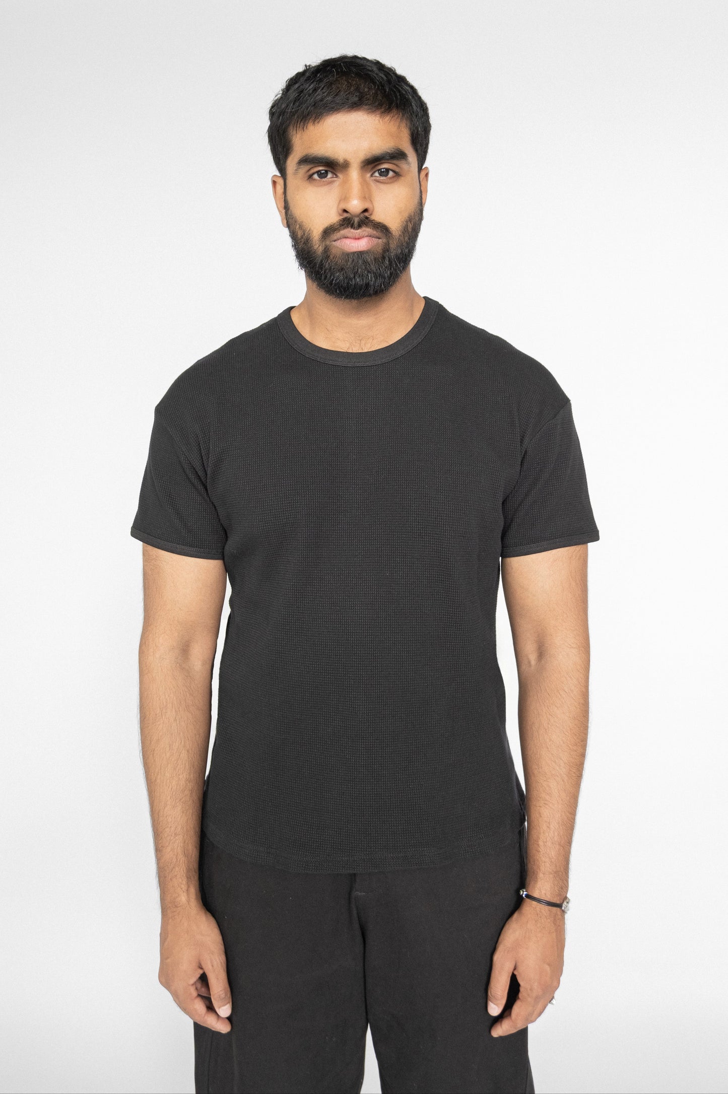 
                  
                    WAFFLE KNIT T-SHIRT BLACK
                  
                