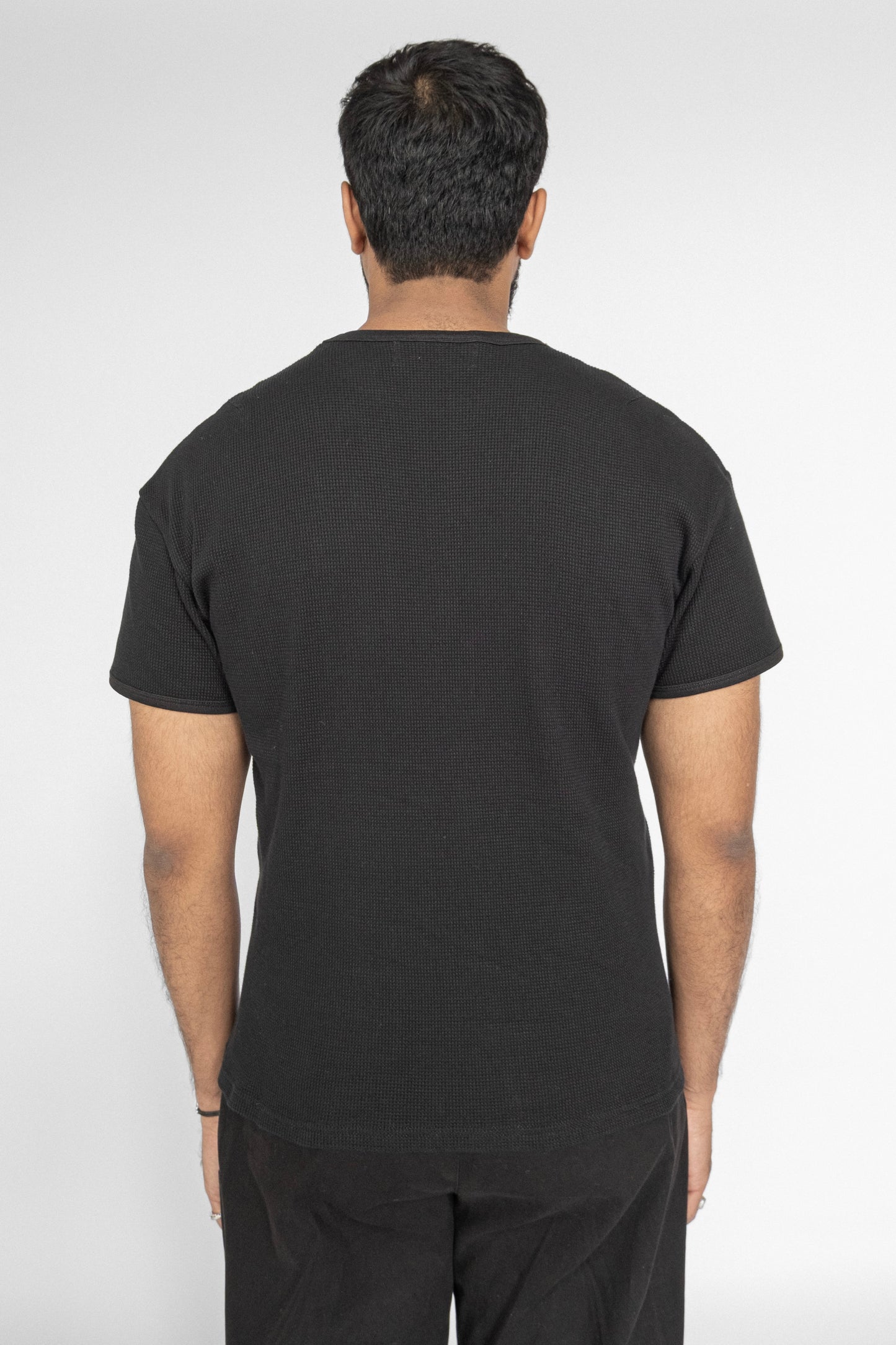 
                  
                    WAFFLE KNIT T-SHIRT BLACK
                  
                
